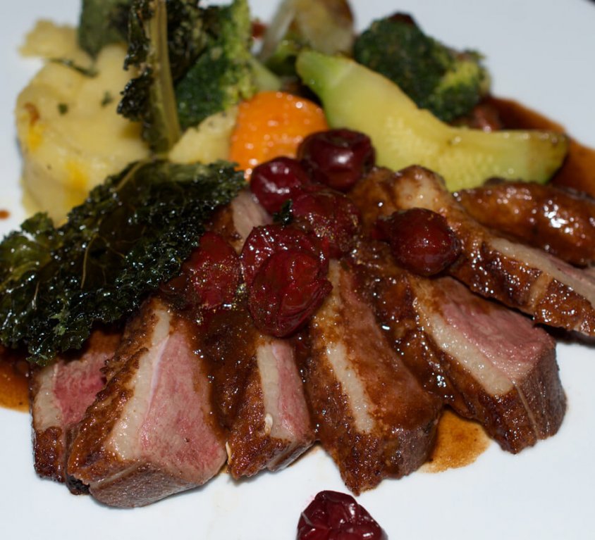 Roast duck breast with honey and Morello cherries